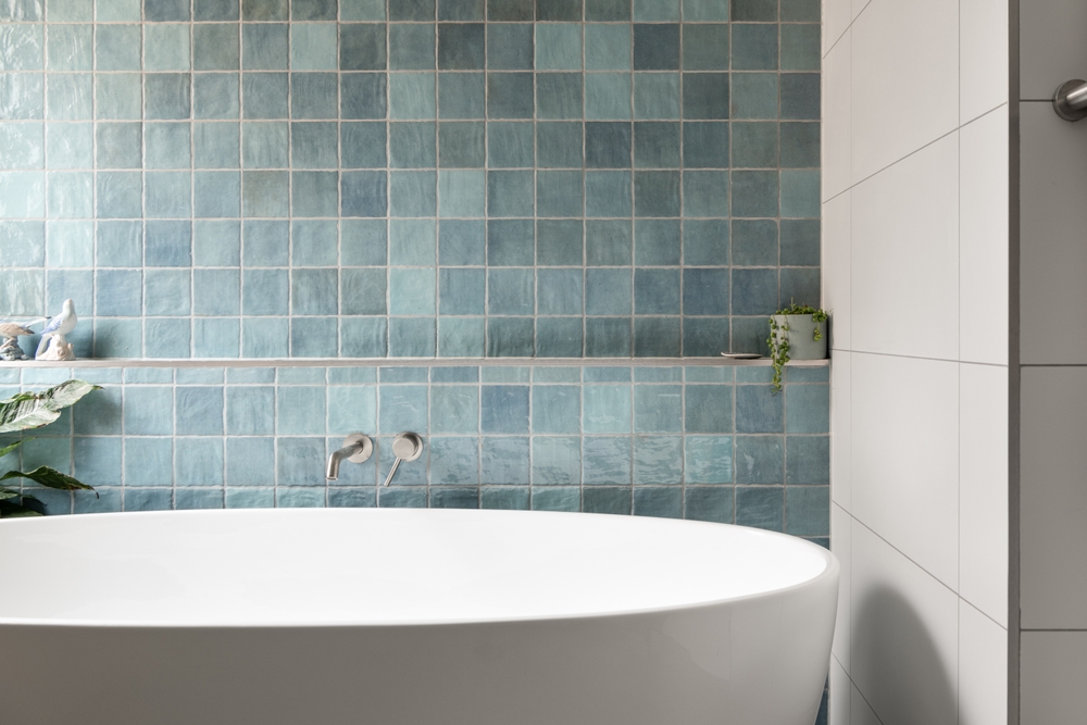 An,elegant,bathtub,in,a,bathroom,photographed,with,natural,light.
